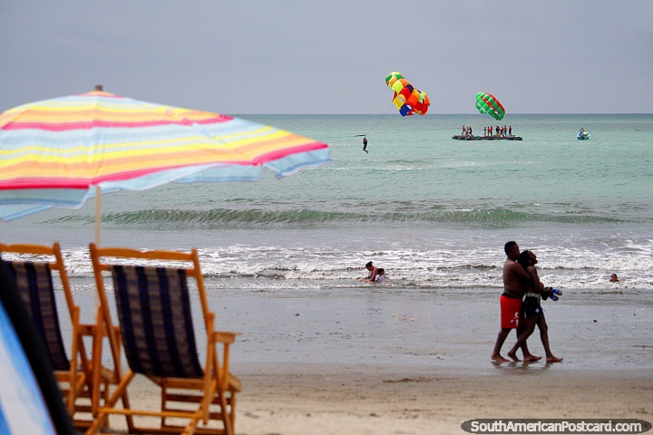 Parasailing is fantastic fun and only costs $10USD for a ride at Atacames beach. (720x480px). Ecuador, South America.
