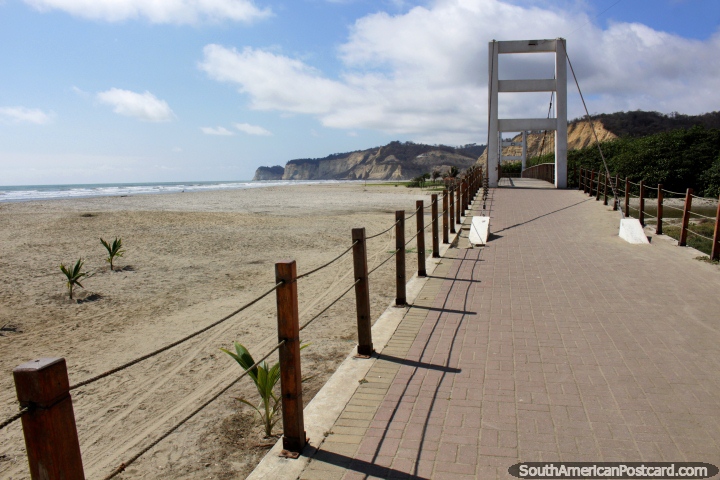 Large walking bridge across the river and the beach at Canoa. (720x480px). Ecuador, South America.