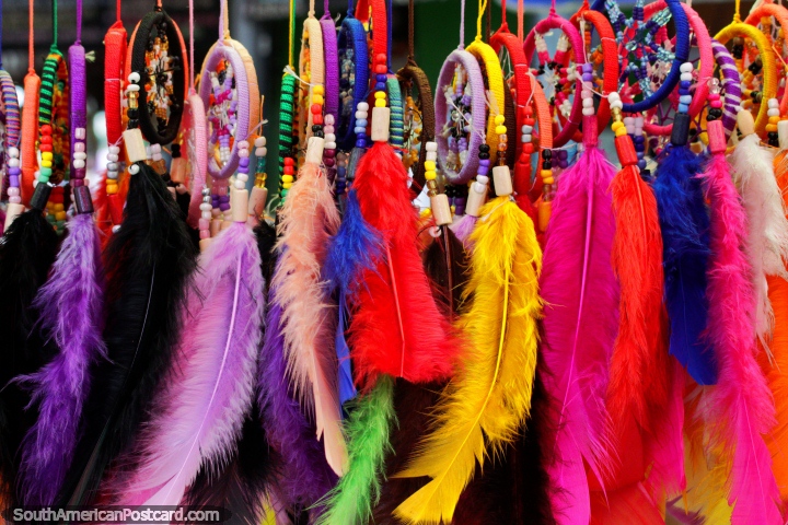 Bright colored dream-catchers with feathers, buy one in Montanita, street crafts. (720x480px). Ecuador, South America.