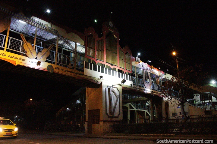 Musical bridge in Loja at night with various instruments, cello, harp, piano and guitar. (720x480px). Ecuador, South America.
