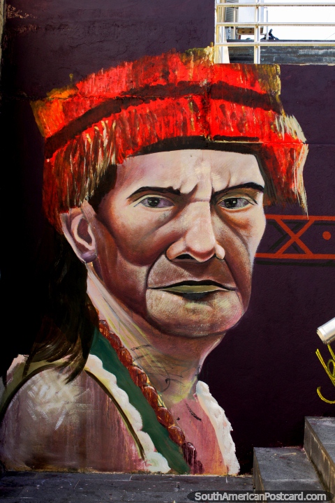 Indigenous man with red head wear, he looks serious, street art in Zamora. (480x720px). Ecuador, South America.