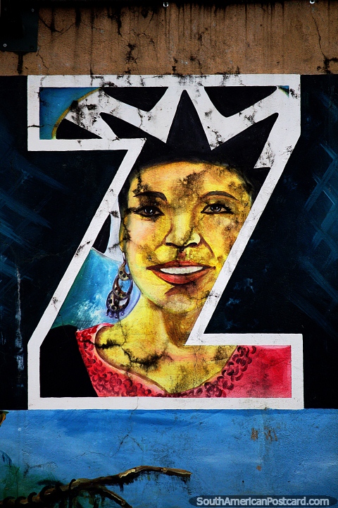Mujer con sombrero y aretes, la primera letra Z en Yantzaza en el nuevo malecón. (480x720px). Ecuador, Sudamerica.