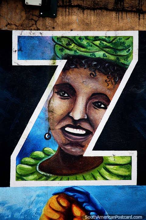 Happy woman dressed in green, the 2nd letter Z in Yantzaza, mural at new malecon. (480x720px). Ecuador, South America.