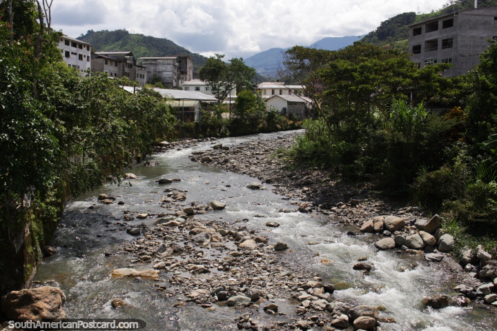 Rocky river and distant mountains in Limon on the Oriente Road. (720x480px). Ecuador, South America.