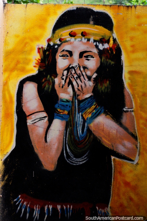 Indigenous girl with yellow headband laughing, mural in Limon. (480x720px). Ecuador, South America.