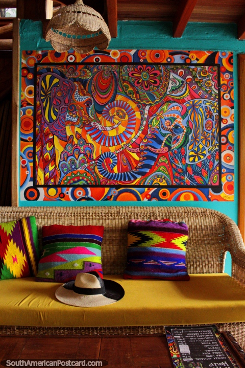 Amazing decor with pillows and a psychedelic painting, Leprechaun Bar, Banos. (480x720px). Ecuador, South America.
