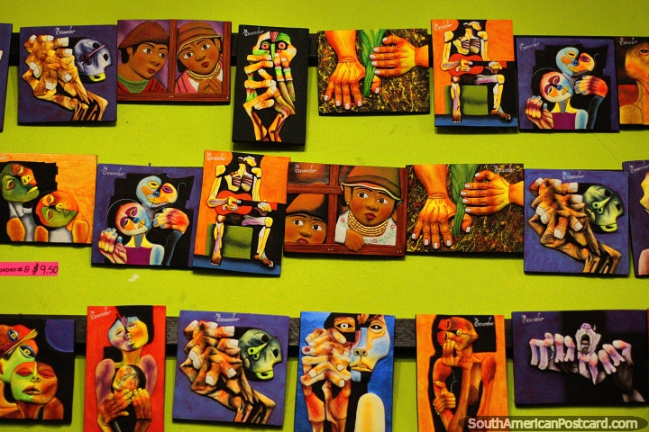 Una pared de interesantes y coloridos estampados artsticos en las tiendas de artesana de Banos. (720x480px). Ecuador, Sudamerica.