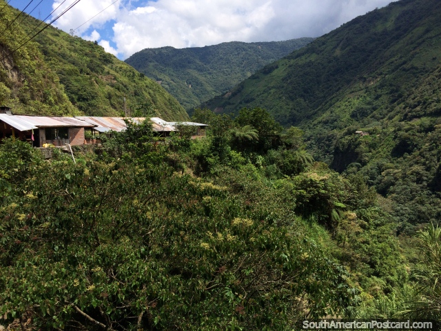 Houses in the hills, near and distant, an amazing setting to live in and around Banos. (640x480px). Ecuador, South America.