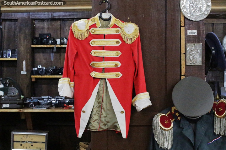 Red and grey military uniforms from the Chaco War at Los Fundadores Museum in Bella Vista. (720x480px). Paraguay, South America.