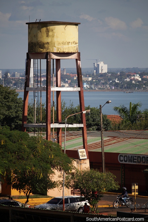 Water tower in Encarnacion with a view across the Parana River to Posadas in Argentina. (480x720px). Paraguay, South America.