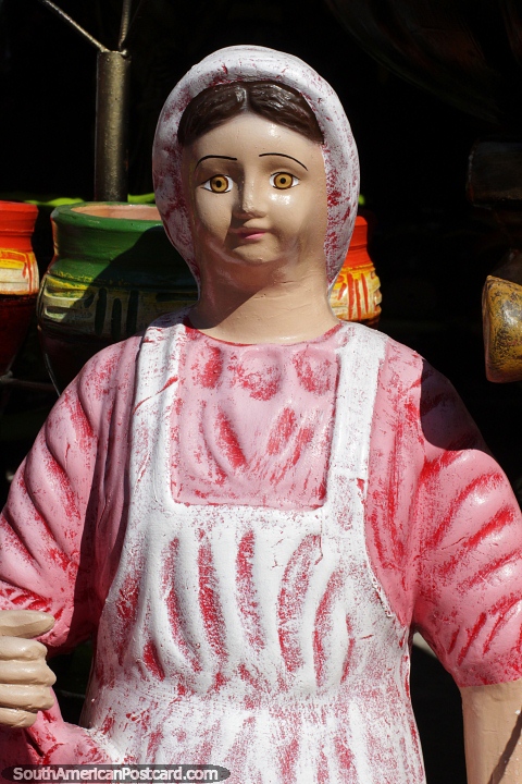 Female figure dressed in pink and white, a ceramic figure in Aregua. (480x720px). Paraguay, South America.
