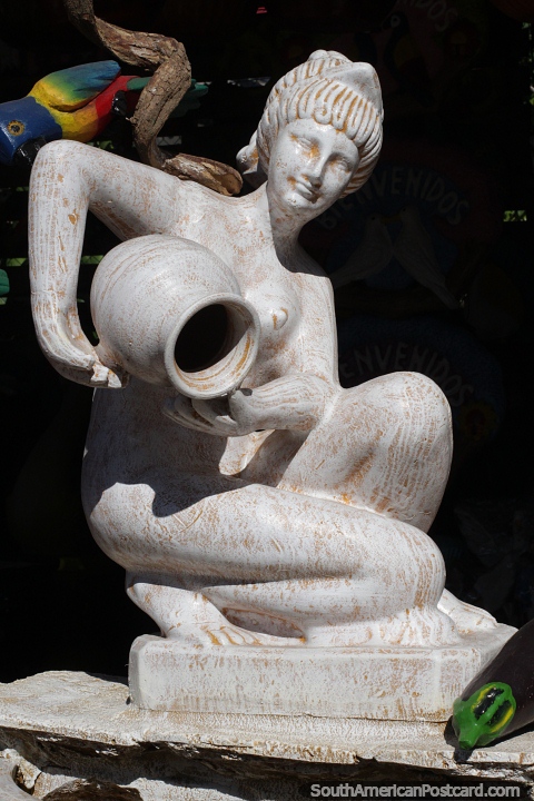 Woman pouring an urn, large ceramic artwork made in Aregua. (480x720px). Paraguay, South America.