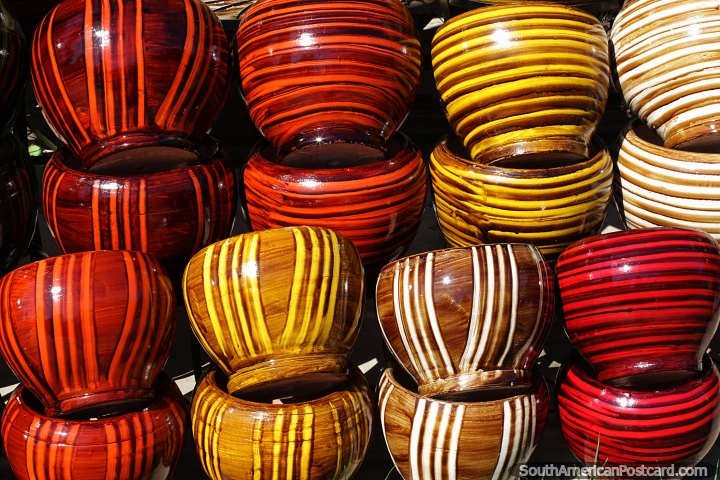 Range of colored ceramic plant holders made in Aregua. (720x480px). Paraguay, South America.