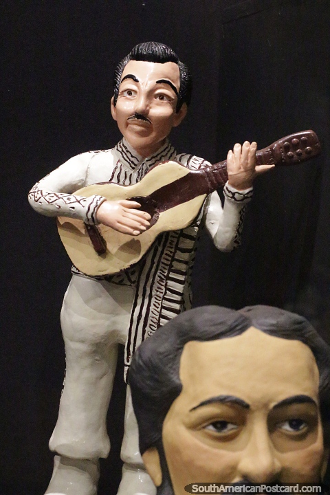 Man playing guitar, ceramic work at the cultural center in Aregua. (480x720px). Paraguay, South America.