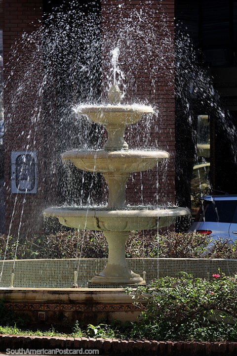 Fountain spraying water in the plaza in Asuncion. (480x720px). Paraguay, South America.