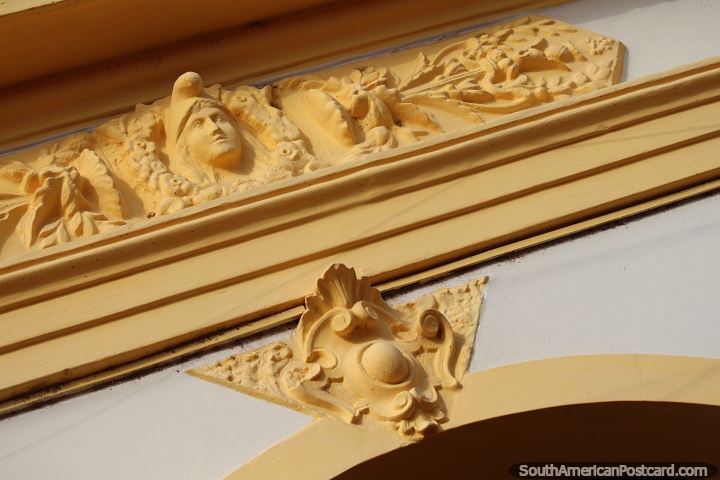 Ceramic face and decoration above a doorway in Concepcion. (720x480px). Paraguay, South America.
