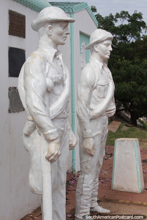 Heroes of the Chaco, monument of 2 soldiers at the port in Concepcion. (480x720px). Paraguay, South America.