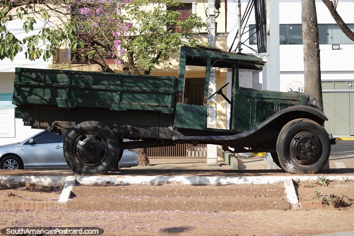 A vintage truck and monument in Concepcion. (720x480px). Paraguay, South America.