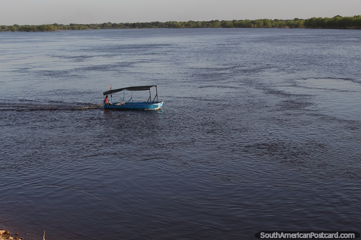 Small boat motors along the Paraguay River in Concepcion. (720x480px). Paraguay, South America.