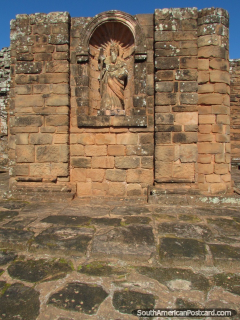 An arch with statue figure at the Jesuit church entrance at Trinidad. (480x640px). Paraguay, South America.