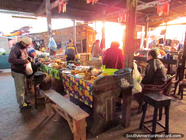 Locals of Paraguari eat breakfast at the markets. (640x480px). Paraguay, South America.