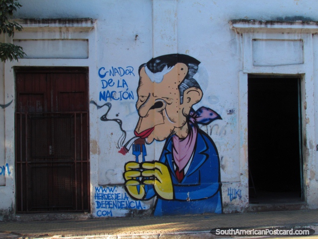 Hombre en pleito azul con cuchillo y atenedor, graffiti de la pared en Asuncin. (640x480px). Paraguay, Sudamerica.