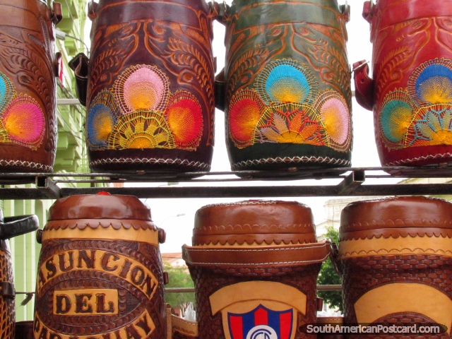 Colorful threaded patterns and designs on leather flasks for sale in Asuncion. (640x480px). Paraguay, South America.