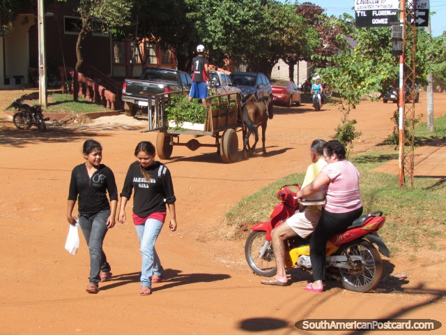 Concepcion modes of transport - walking, motorbike and horse pulled cart. (640x480px). Paraguay, South America.