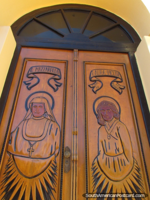 1 of the 3 wooden doors at the church in Concepcion, depicting D. Mazzarello and Laura Vicuna. (480x640px). Paraguay, South America.