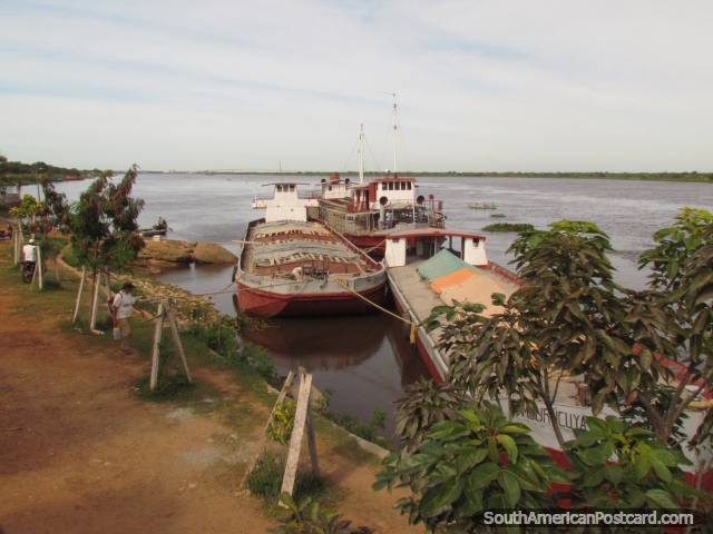 Cargo boats docked at the port in Concepcion. (640x480px). Paraguay, South America.