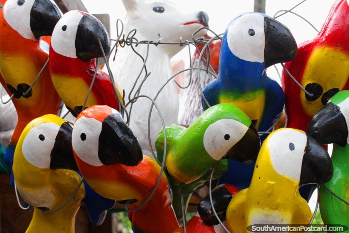 Ceramic or wooden parakeets of bright colors, made in Aregua. (720x480px). Paraguay, South America.