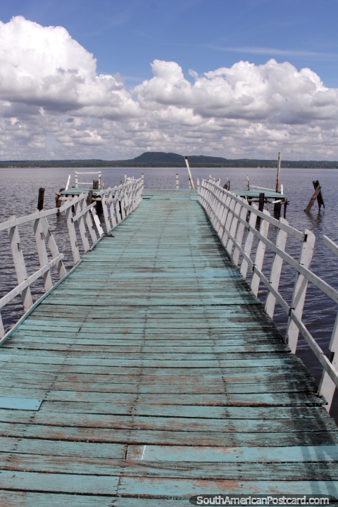 Jetty on Lake Ypacarai at San Bernardino, distant bush-land. (480x720px). Paraguay, South America.