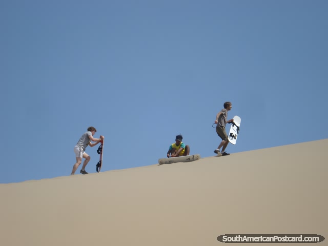 Getting ready to sandboard the dunes of Huacachina. (640x480px). Peru, South America.