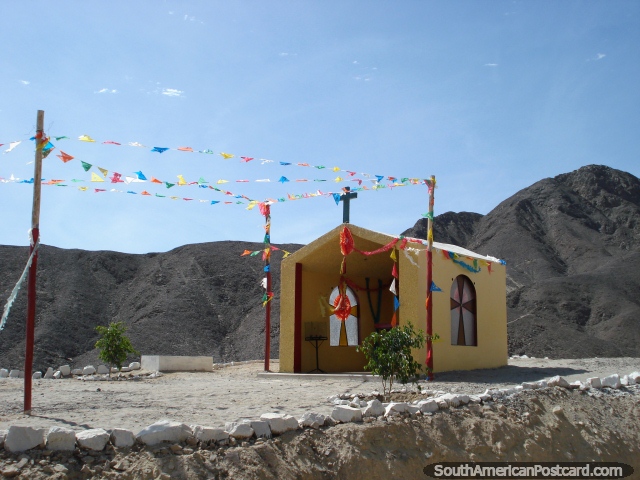 South of Ica on top of a rocky mountain is this yellow church. (640x480px). Peru, South America.