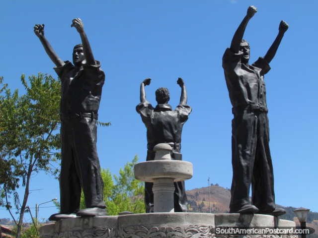 War of San Pablo (1882) monument in Cajamarca, 3 men hold fists in air. (640x480px). Peru, South America.
