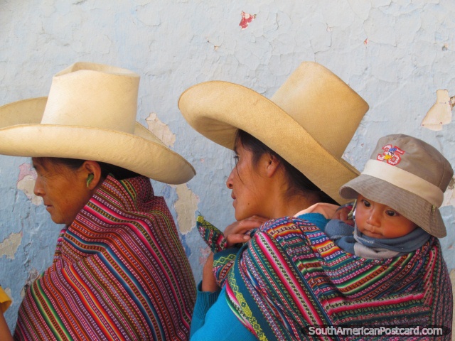 Indigenous locals wear traditional clothing in Cajamarca streets. (640x480px). Peru, South America.