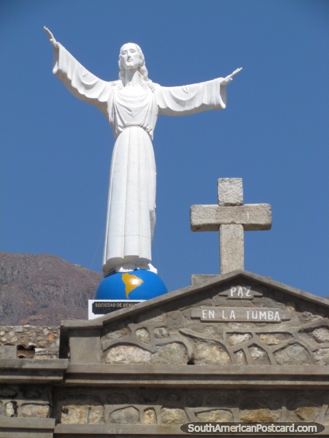 Statue of Jesus stands over Campo Santo in Yungay. (480x640px). Peru, South America.