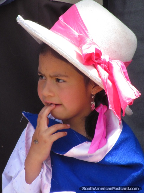Young girl with hat and pink ribbon in Huaraz street celebrations. (480x640px). Peru, South America.
