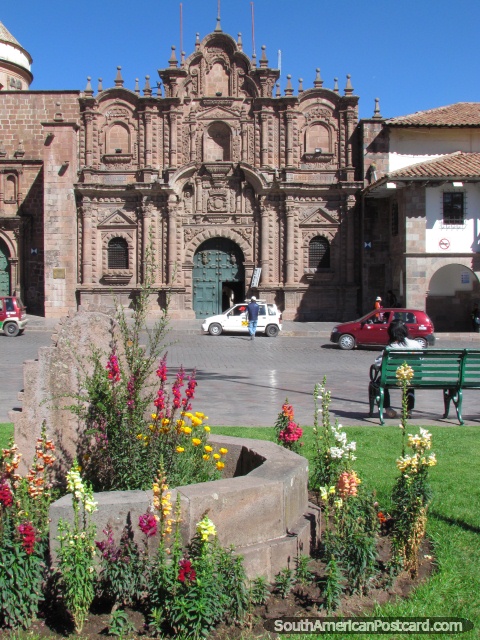 Flower gardens and the church of La Compania in Cusco. (480x640px). Peru, South America.