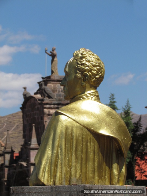 Gold Simon Bolivar monument in Cusco, behind is Arco Santa Clara. (480x640px). Peru, South America.