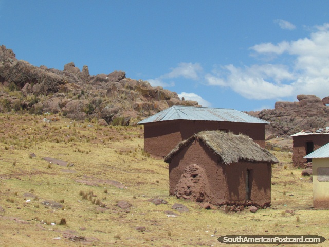 Mud houses on a hillside between Puno and Yunguyo. (640x480px). Peru, South America.