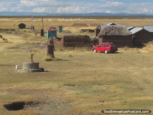 A simple farm with Lake Titicaca in the distance near Juli. (640x480px). Peru, South America.