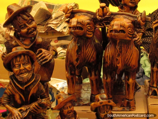 Fine wooden sculptures of indigenous people and animals at the art fair in Chimbote. (640x480px). Peru, South America.
