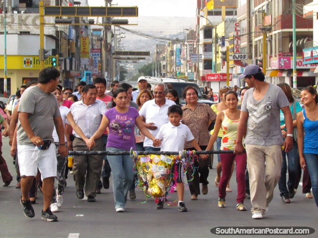 People of Chimbote celebrate a festival in the city streets. (640x480px). Peru, South America.