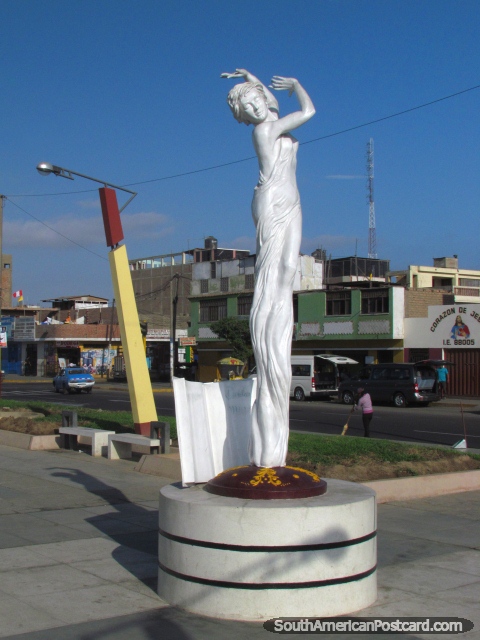 Tall thin dancing woman artwork in Chimbote, Isla Blanca Boulevard. (480x640px). Peru, South America.