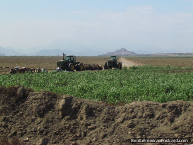 Tractors in the fields between Trujillo and Paijan. (640x480px). Peru, South America.