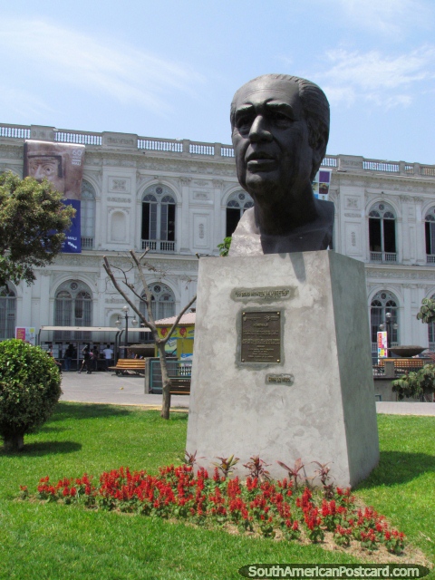 Red flowers and bust of ex-president Fernando Belaunde Terry in Lima. (480x640px). Peru, South America.