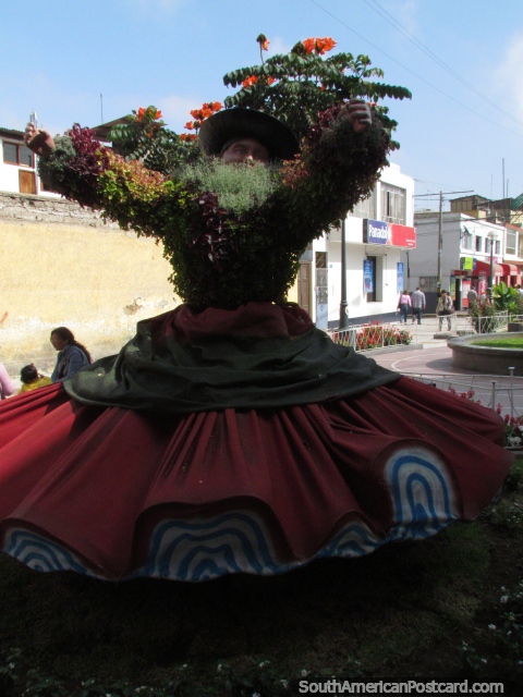 A woman made of flowers in the gardens at Pasaje Vigil in Tacna. (480x640px). Peru, South America.