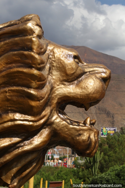 The great golden lion monument in Huanuco, icon of the city. (480x720px). Peru, South America.