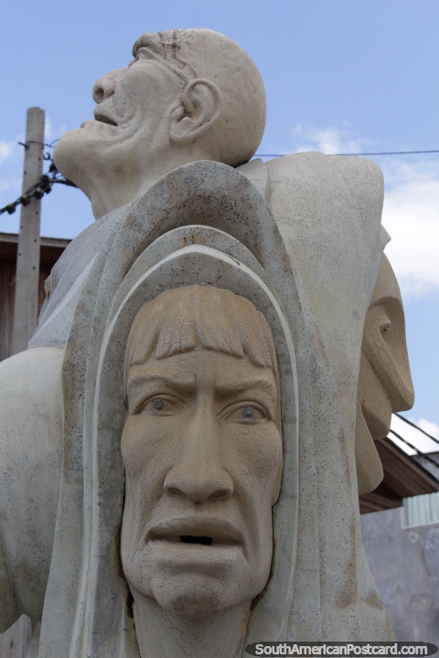 Stone monument of some terrified looking people in Pucallpa. (480x720px). Peru, South America.
